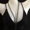 Black Round Beaded Gold Chain Necklace with Long Back Fluffy Fur Ball Pendant