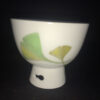 High-quality White Porcelain Tea Cup Cut Out Base Printed Fan Leaf Design